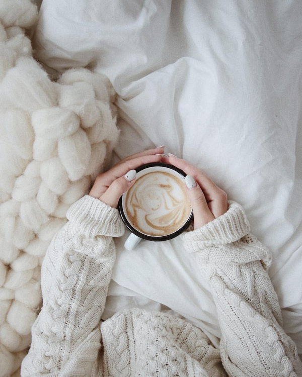 Taking care of yourself in the winter. Stay Warm in the cold weather. drink a cup of tea or coffee. Cosy bedroom. relax yourself this Sunday.
